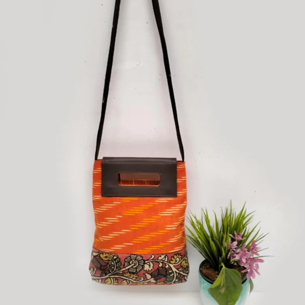 Orange ikat cotton kalamkari handcrafted sling bag