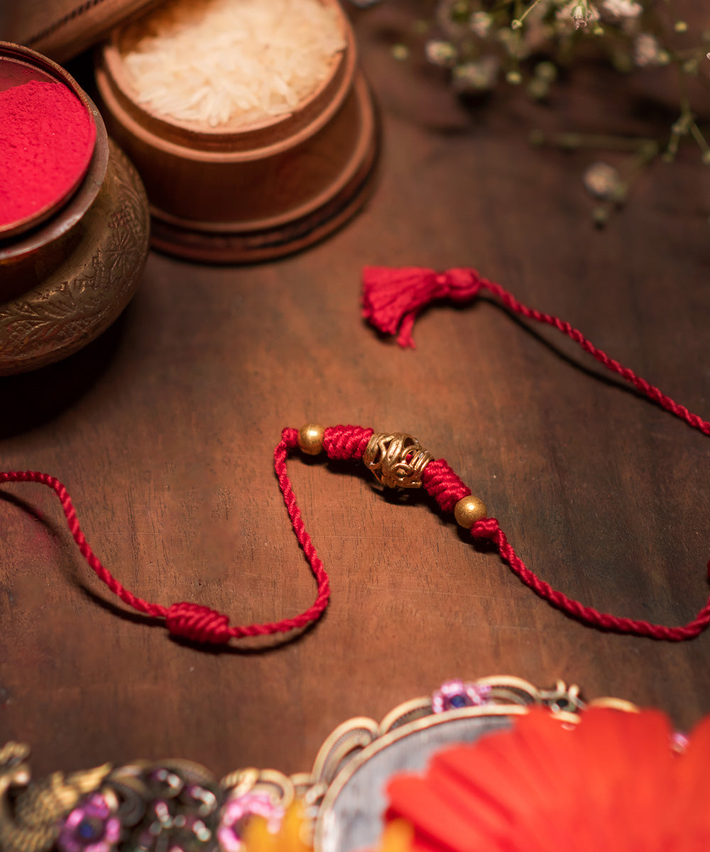 Hand crafted dokhra rakhi with mercerised cotton thread