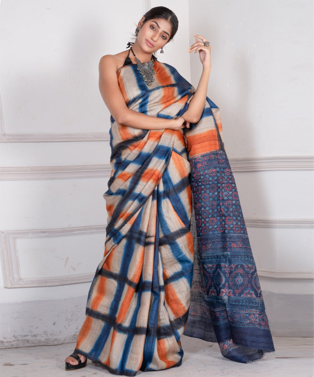 Indigo orange tussar silk clamp dye saree with ajrakh blouse and pallu
