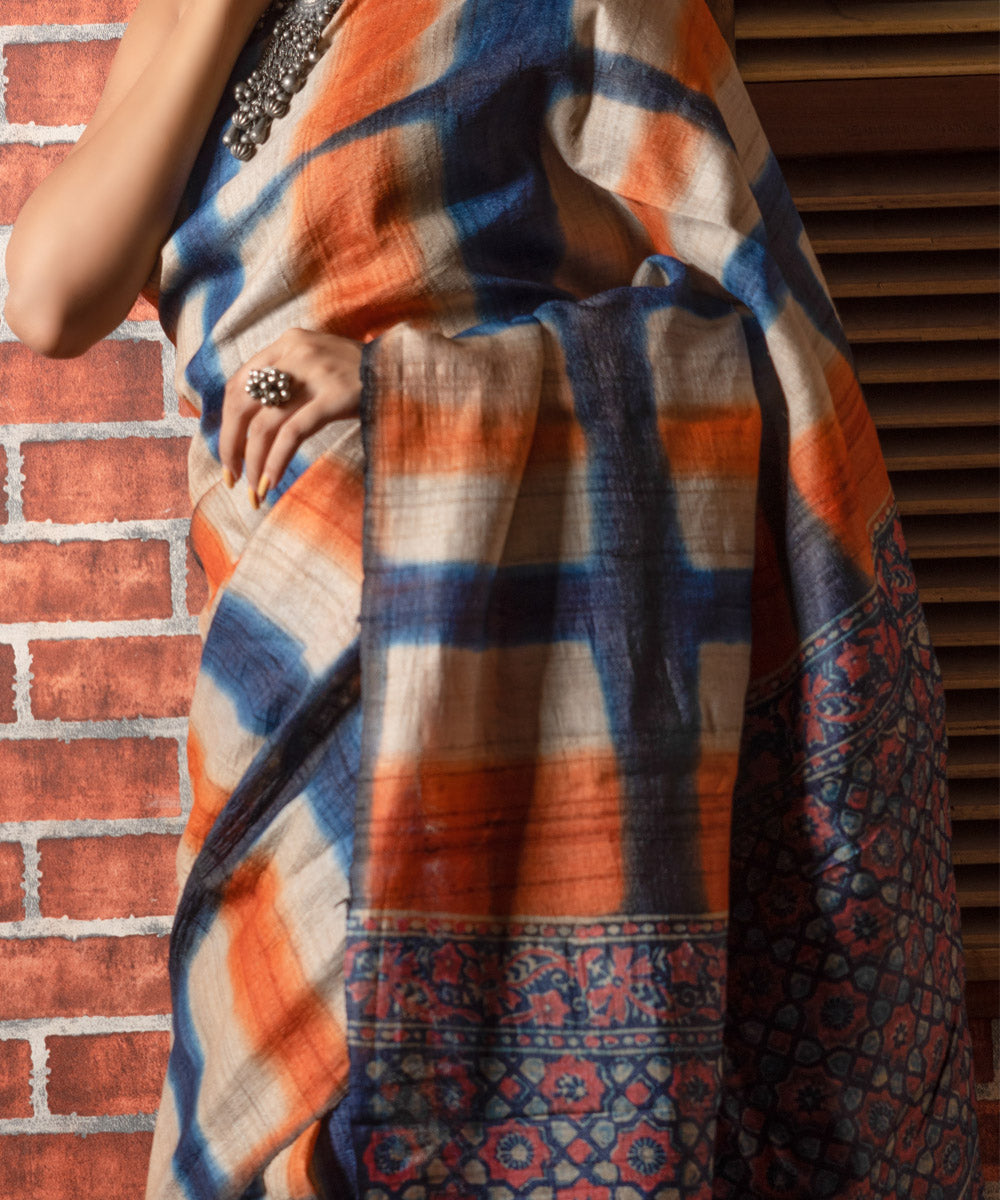 Indigo orange tussar silk clamp dye saree with ajrakh blouse and pallu