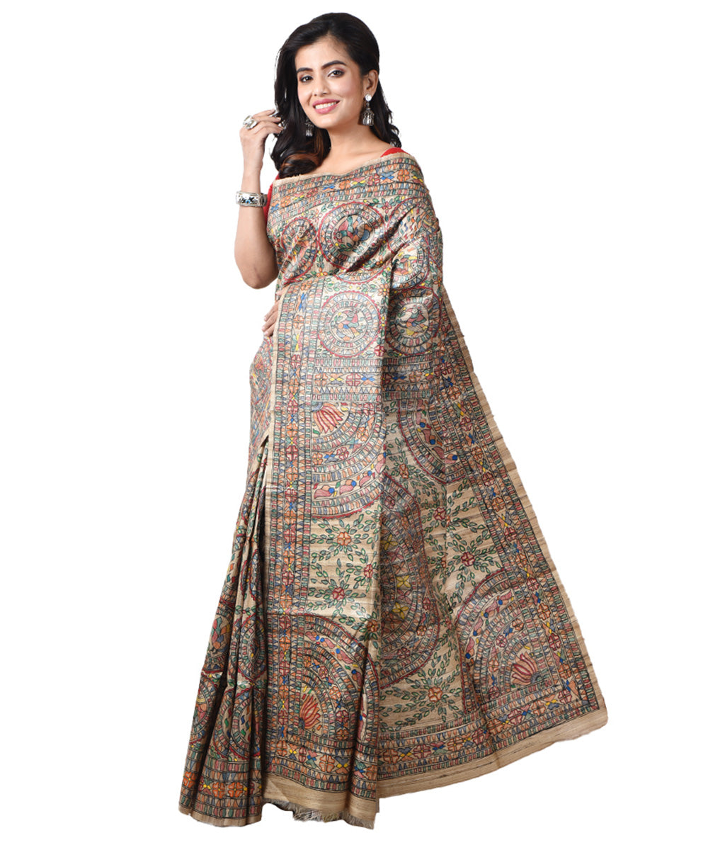 Beige bengal tussar silk multicolour hand painted madhubani saree