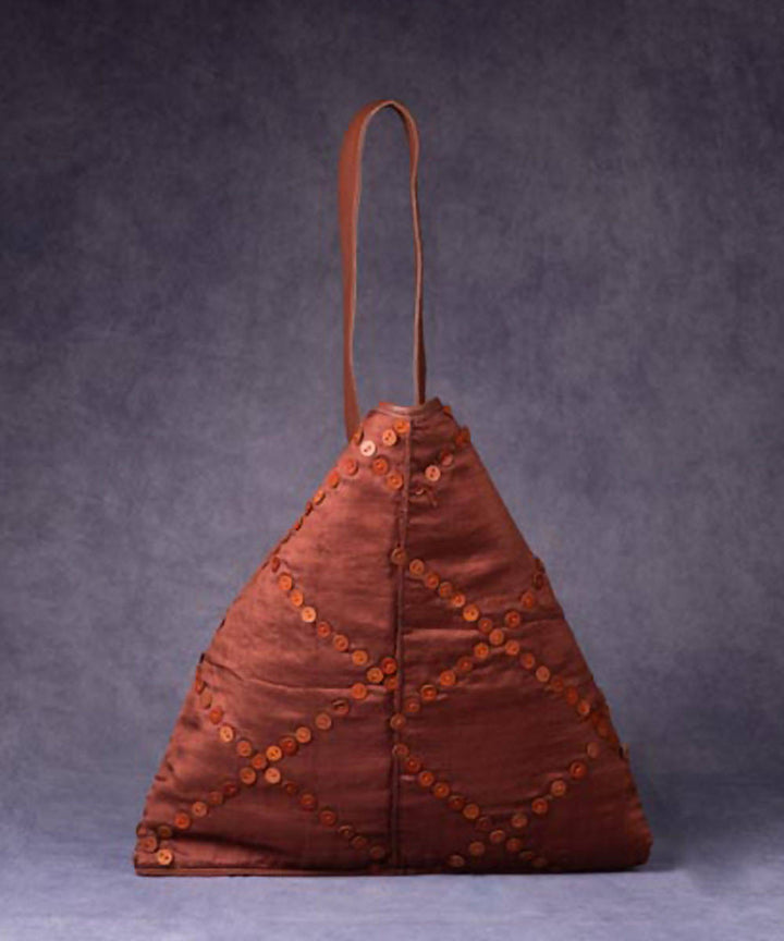 Rust brown handmade silk triangle bag with leather buttons and handle