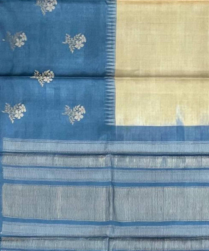 Cream and blue handwoven tussar silk saree with flower motif