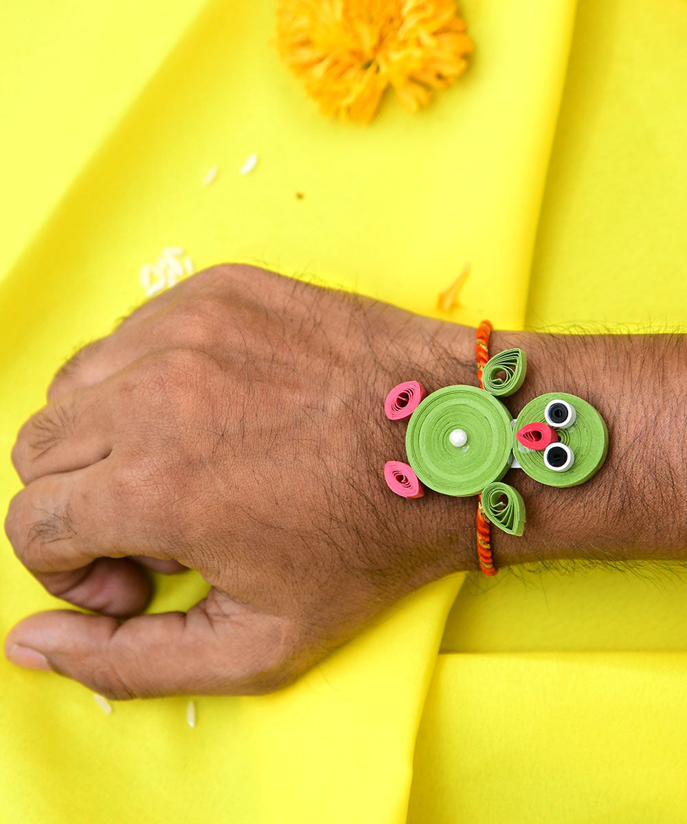 Green handcrafted paper quilling rakhi