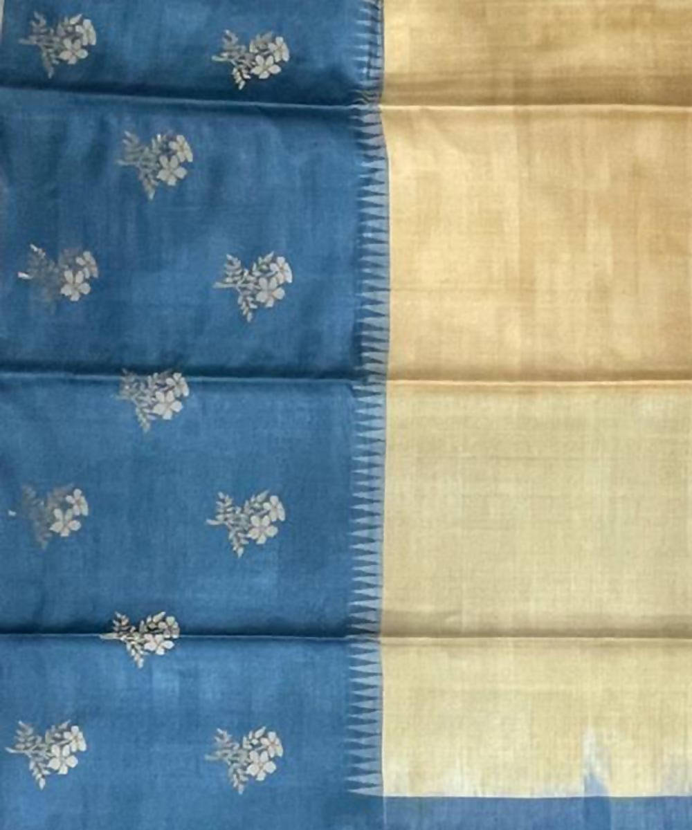 Cream and blue handwoven tussar silk saree with flower motif