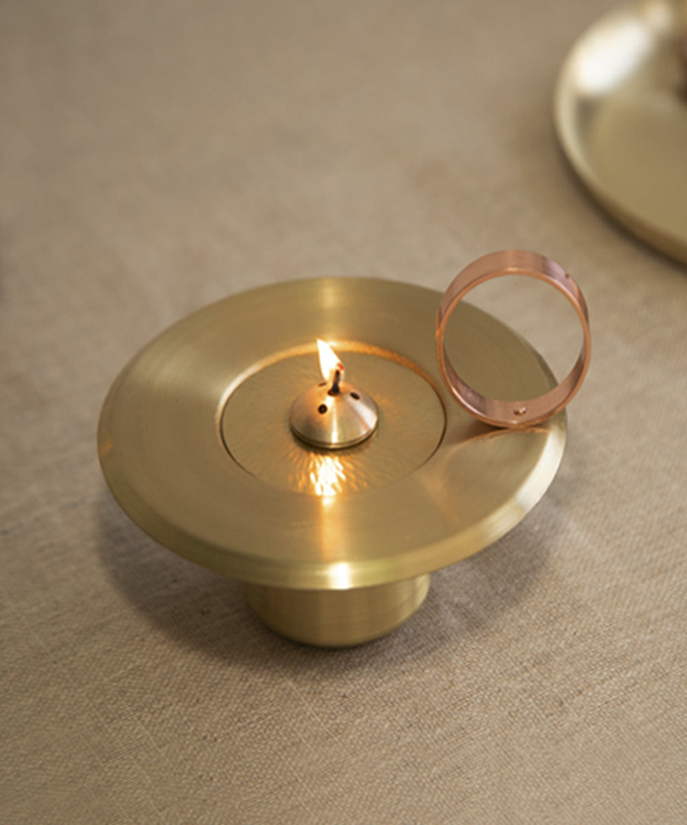 Handmade brass lunar oil lamp with copper handle