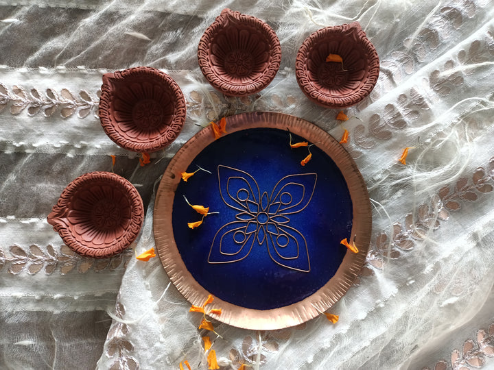 Blue handcrafted pooja thali and terracotta diya set