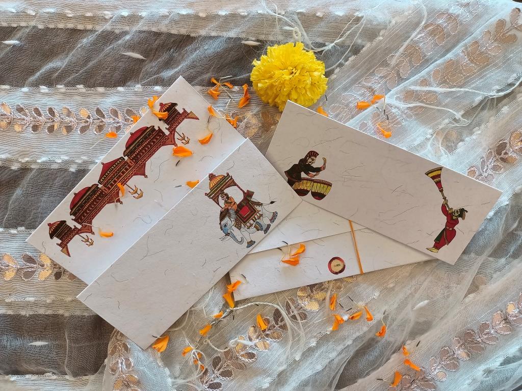 Handcrafted chitrakathi envelope and terracotta diya set