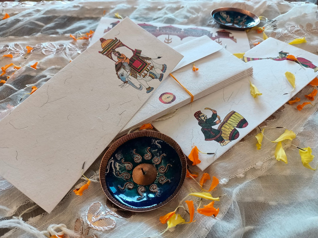 Handcrafted chitrakathi envelope and copper enamel diya set