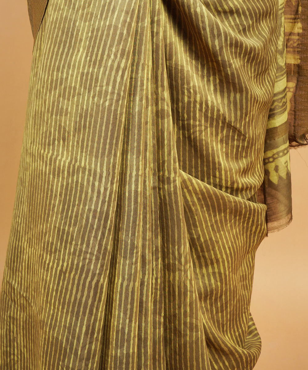 Olive green gheecha border cotton silk hand block dabu printed sari