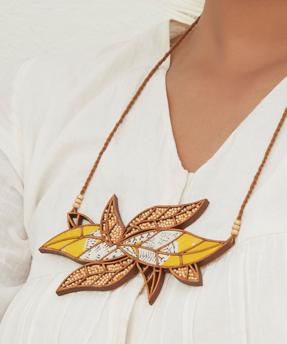 Handcrafted yellow leaf motif fabric and wood necklace