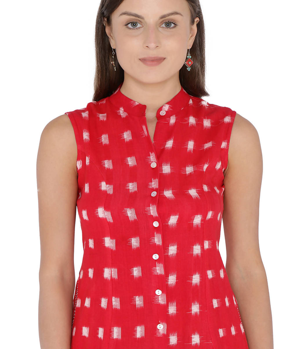 Sleeveless red and white double ikat cotton dress with embroidered pockets